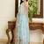 Turquoise embroidered sarees with unstitched blouse piece
