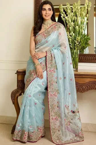 Turquoise embroidered sarees with unstitched blouse piece