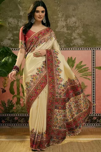 Off white position printed zari weaving saree with contrast blouse piece