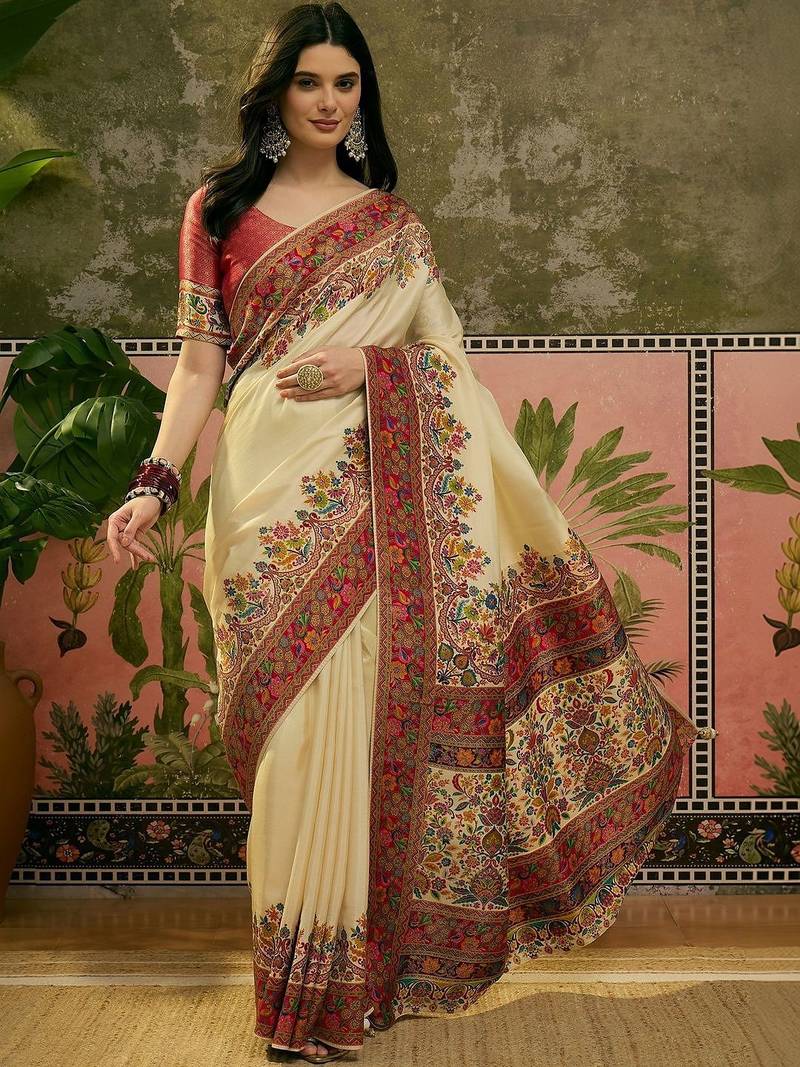 Off white position printed zari weaving saree with contrast blouse piece
