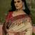 Off white position printed zari weaving saree with contrast blouse piece
