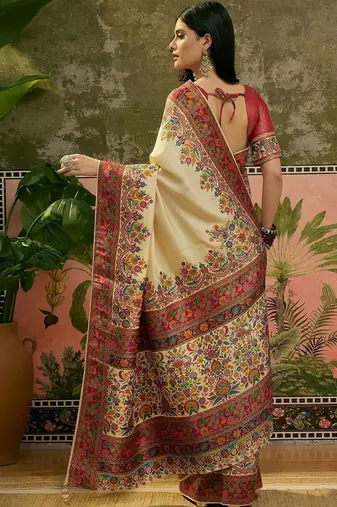 Off white position printed zari weaving saree with contrast blouse piece
