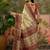 Off white position printed zari weaving saree with contrast blouse piece