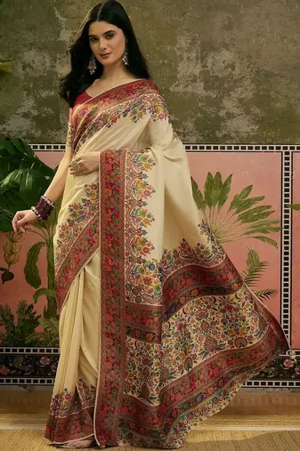 Off white position printed zari weaving saree with contrast blouse piece