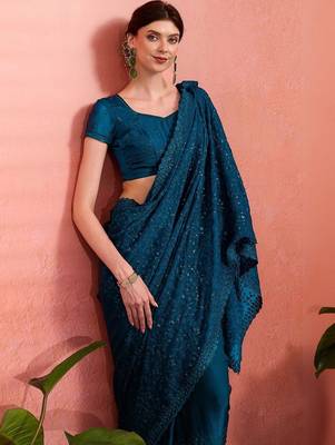 Teal ethnic embroidered festive wear saree with matching blouse 1