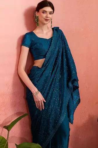 Teal ethnic embroidered festive wear saree with matching blouse