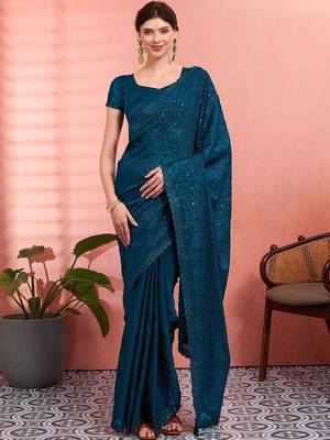 Teal ethnic embroidered festive wear saree with matching blouse 2