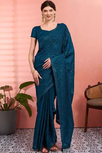 Teal ethnic embroidered festive wear saree with matching blouse