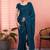 Teal ethnic embroidered festive wear saree with matching blouse