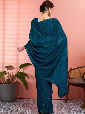 Teal ethnic embroidered festive wear saree with matching blouse 3