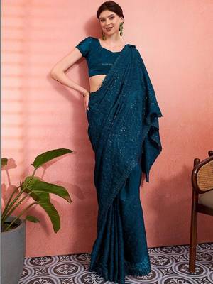 Teal ethnic embroidered festive wear saree with matching blouse 4