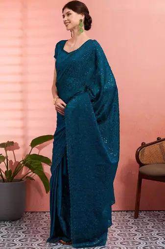 Teal ethnic embroidered festive wear saree with matching blouse