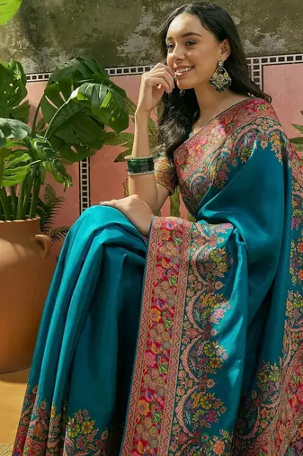 Teal position printed zari weaving saree with contrast blouse piece