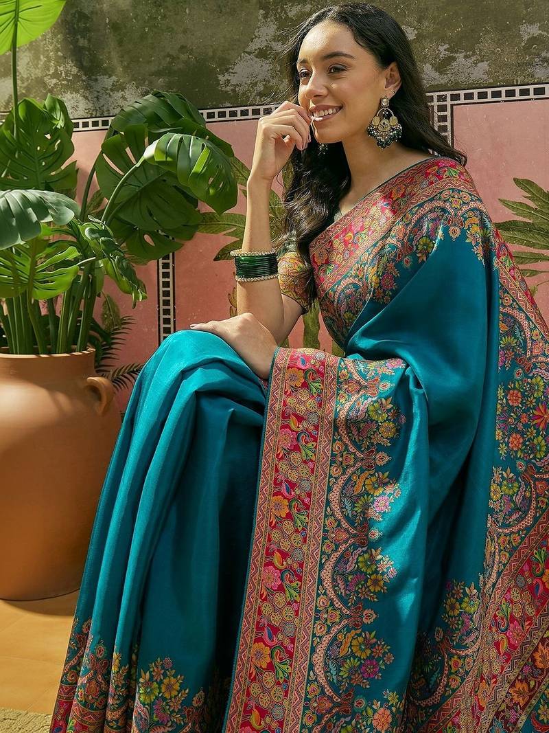 Teal position printed zari weaving saree with contrast blouse piece
