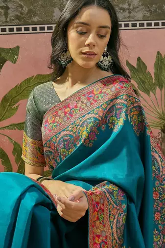 Teal position printed zari weaving saree with contrast blouse piece