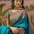 Teal position printed zari weaving saree with contrast blouse piece