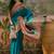 Teal position printed zari weaving saree with contrast blouse piece