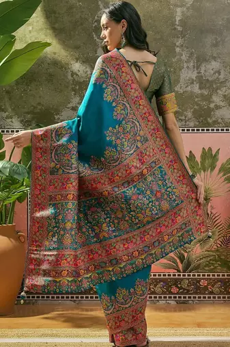 Teal position printed zari weaving saree with contrast blouse piece