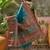 Teal position printed zari weaving saree with contrast blouse piece