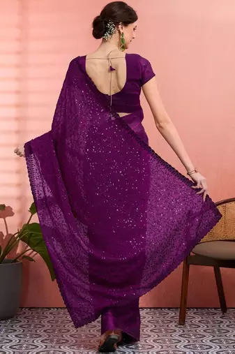 Purple ethnic embroidered festive wear saree with matching blouse