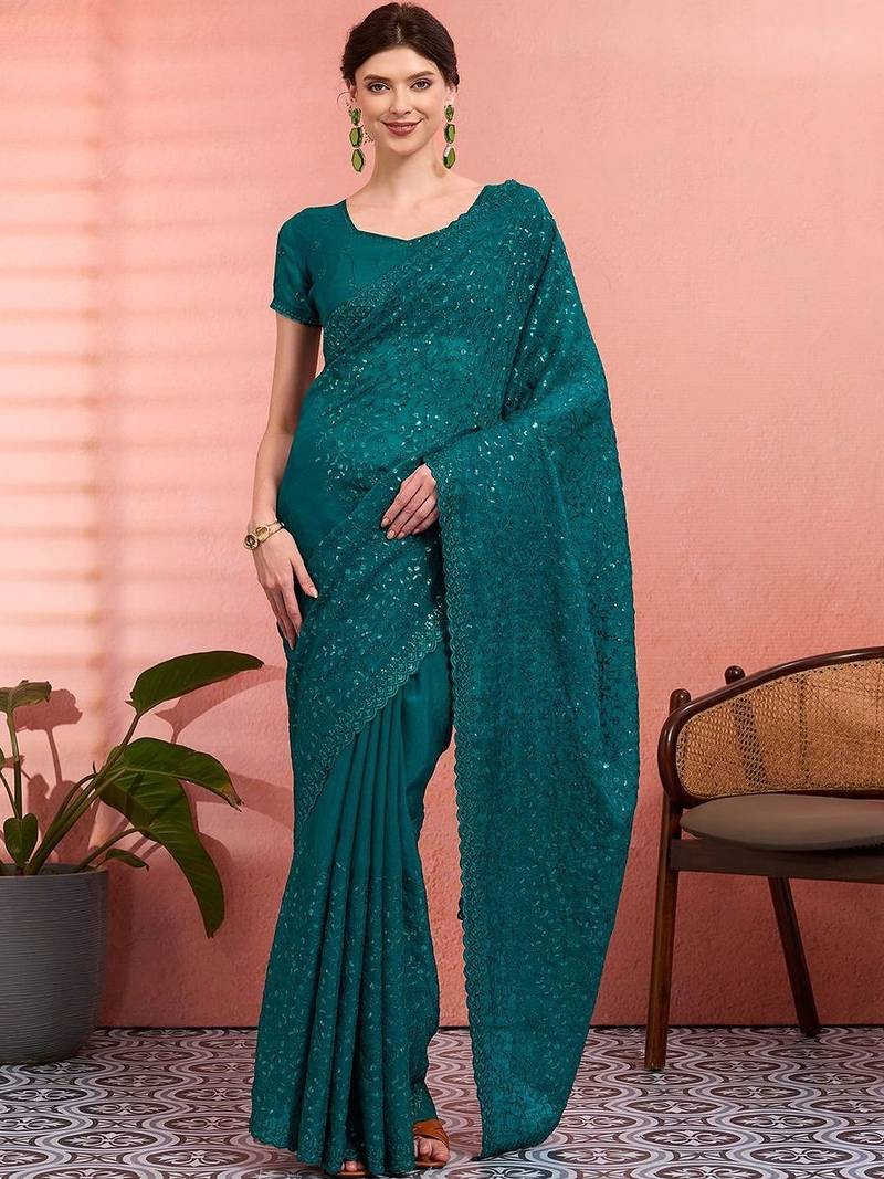 Teal ethnic embroidered festive wear saree with matching blouse