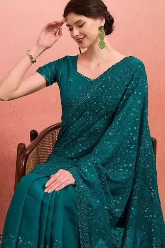 Teal ethnic embroidered festive wear saree with matching blouse