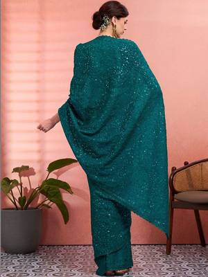 Teal ethnic embroidered festive wear saree with matching blouse 3