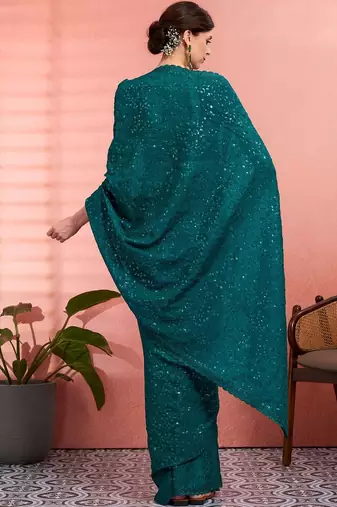 Teal ethnic embroidered festive wear saree with matching blouse