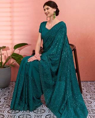 Teal ethnic embroidered festive wear saree with matching blouse 4