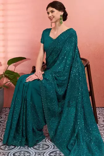 Teal ethnic embroidered festive wear saree with matching blouse