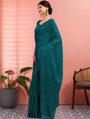Teal ethnic embroidered festive wear saree with matching blouse 5