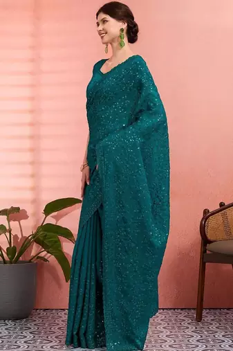 Teal ethnic embroidered festive wear saree with matching blouse