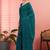 Teal ethnic embroidered festive wear saree with matching blouse