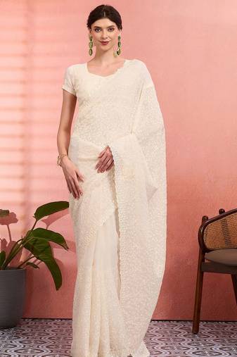 Off white ethnic embroidered festive wear saree with matching blouse