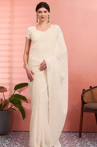Off white ethnic embroidered festive wear saree with matching blouse