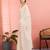 Off white ethnic embroidered festive wear saree with matching blouse