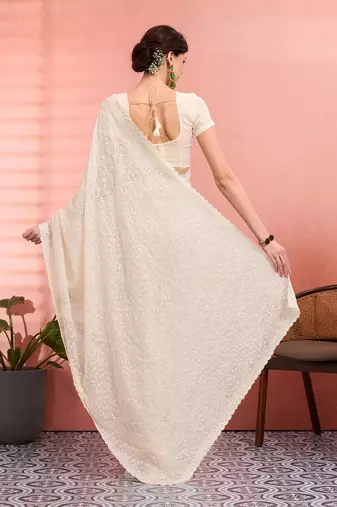 Off white ethnic embroidered festive wear saree with matching blouse