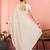 Off white ethnic embroidered festive wear saree with matching blouse