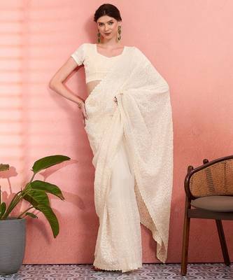 Off white ethnic embroidered festive wear saree with matching blouse 4