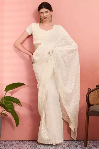 Off white ethnic embroidered festive wear saree with matching blouse