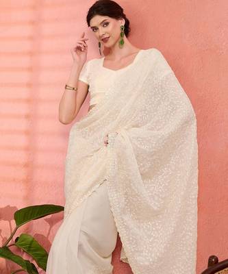 Off white ethnic embroidered festive wear saree with matching blouse 5