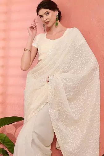 Off white ethnic embroidered festive wear saree with matching blouse