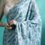 Turquoise geometric printed saree with blouse piece