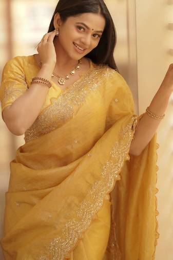Yellow embellished embroidered sequinned saree with blouse piece