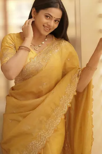 Yellow embellished embroidered sequinned saree with blouse piece