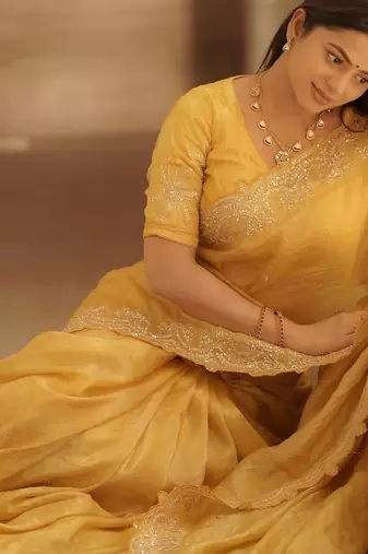Yellow embellished embroidered sequinned saree with blouse piece