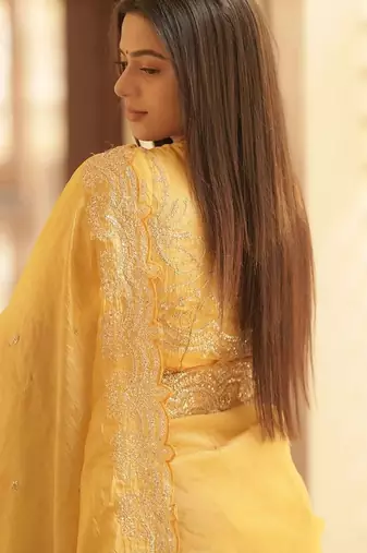 Yellow embellished embroidered sequinned saree with blouse piece