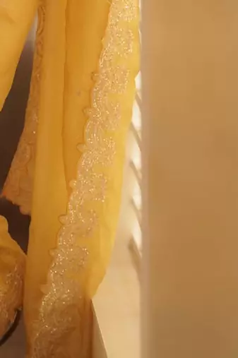 Yellow embellished embroidered sequinned saree with blouse piece