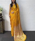 Yellow bandhani mirror work bandhani saree