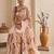 Cream women cream coloured purple floral printed pre draped saree